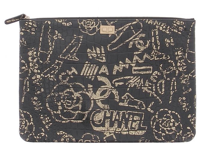 Chanel Bolso de mano de cuero negro y dorado