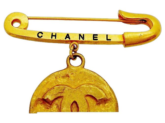 Spilla Chanel placcata oro D'oro