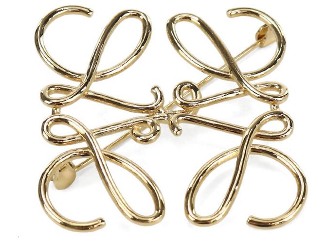 Broche de metal dorado Loewe