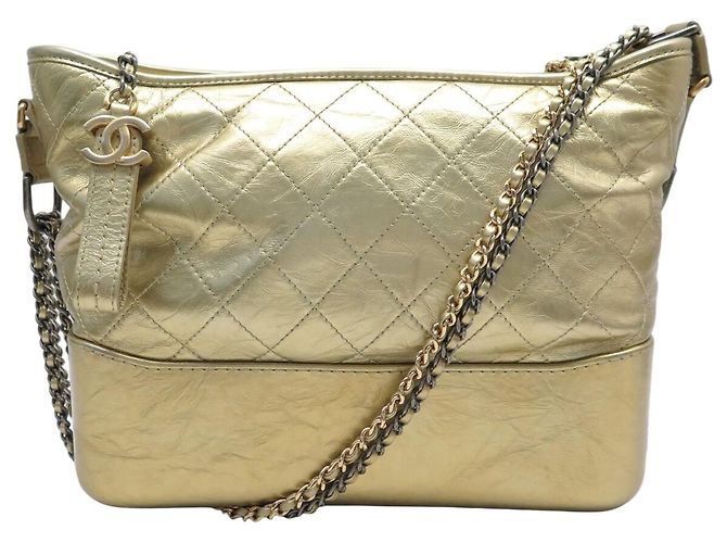 BOLSA DE MÃO CHANEL GABRIELLE MEDIUM A93824Y COURO DOURADO COM ALÇA