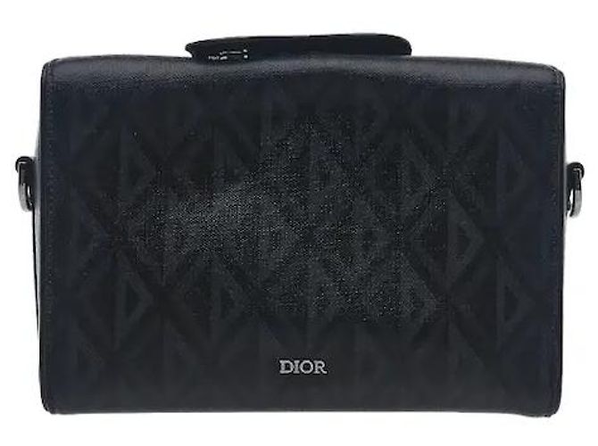 Christian Dior The Dior house's sophisticated Lingot bag line's distinctive rectangular tab detailing harmonizes with luxurious leather material for a sophisticated mood. Its practical case silhouette allows Black