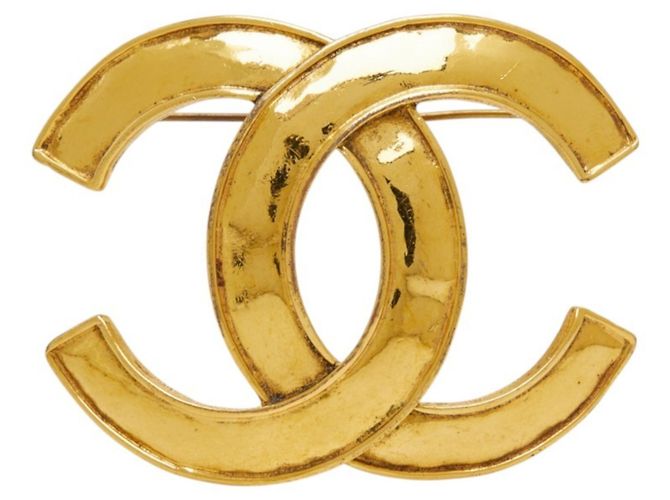 Spilla vintage Chanel Coco Mark placcata in oro D'oro