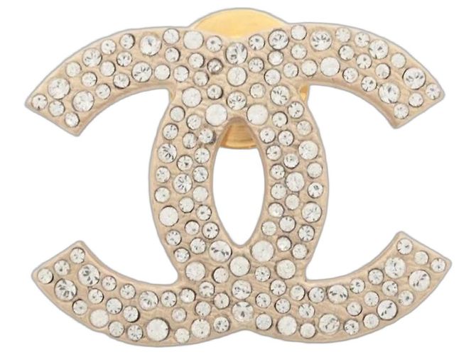 Chanel Broche dourada com strass