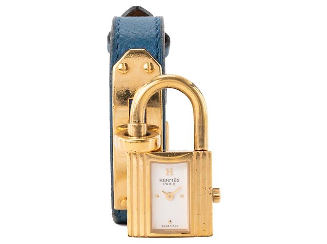HERMÈS - Relógio Kelly Hermès em banho de ouro e couro grão azul