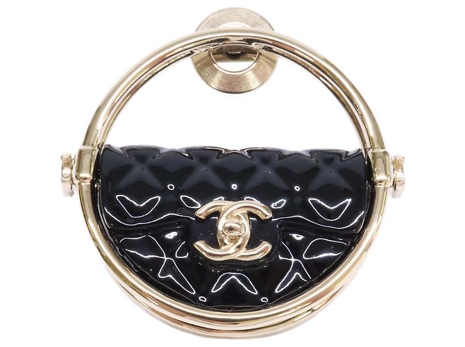 Broche Chanel en oro negro