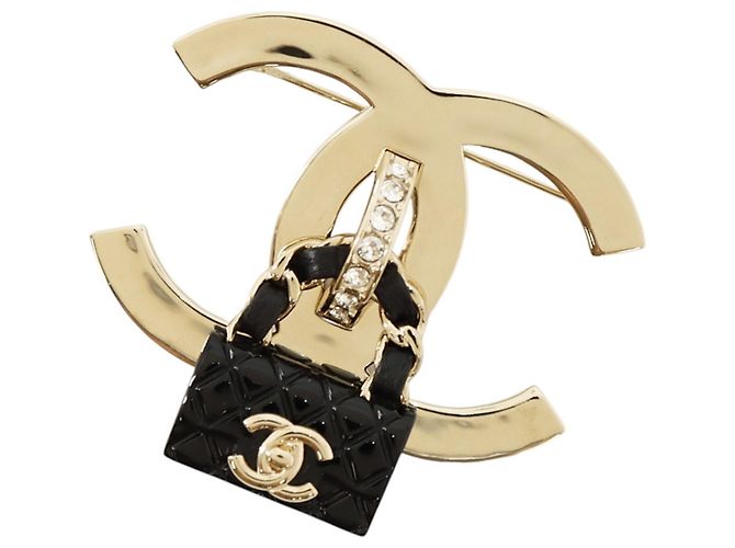 Broche Chanel de strass Dorado