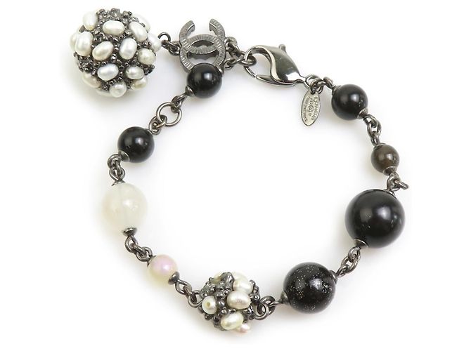 Bracelet à breloques Chanel Noir Blanc Métallisé