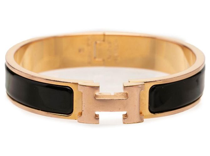 Hermès Pulsera Hermes Click H con dije Negro Dorado