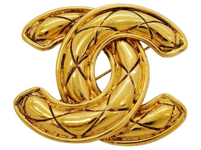 Broche Chanel chapado en oro Dorado