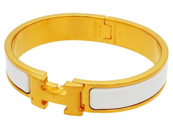 Bracciale Hermès Clic Clac PM in Oro e Bianco D'oro