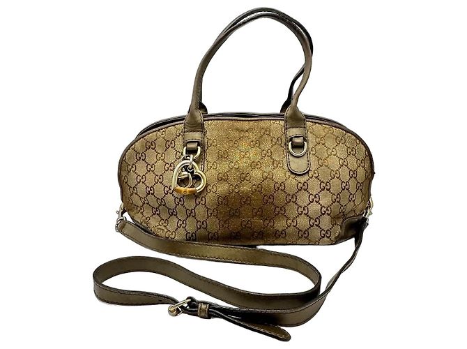 Borsa Boston Gucci Monogram con ciondolo a cuore Marrone