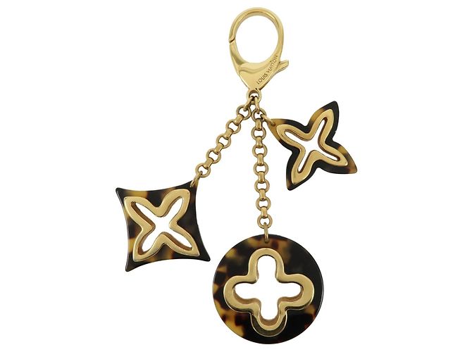 Charm per borsa Louis Vuitton Insolence in metallo e tartaruga D'oro