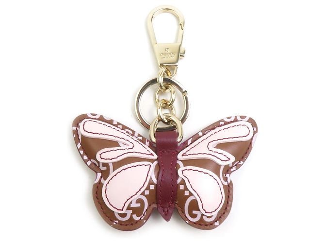 Chaveiro Gucci com pingente de borboleta