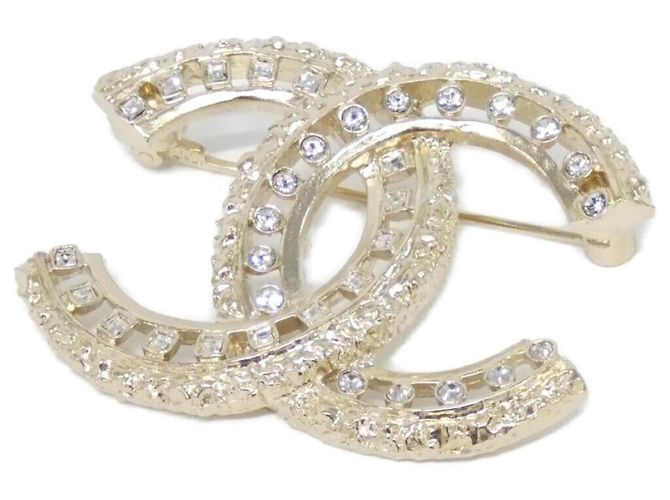 Spilla Chanel AB7765 Oro e Trasparente D'oro