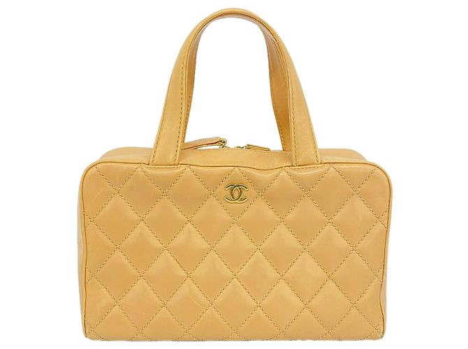 Bolsa Chanel Wild Stitch em pele de cordeiro Bege