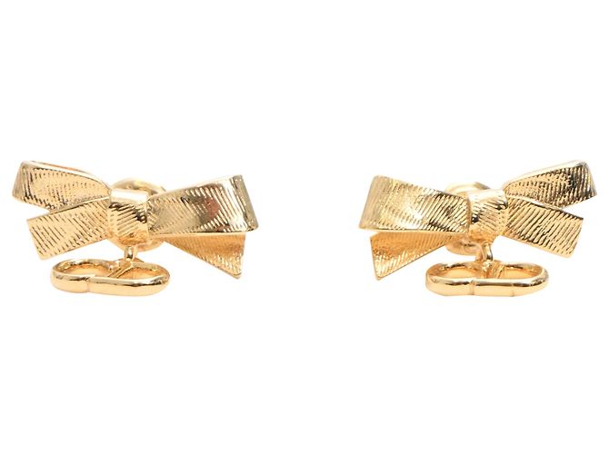 Pendientes de botón Dior CD Bow en metal dorado Metálico