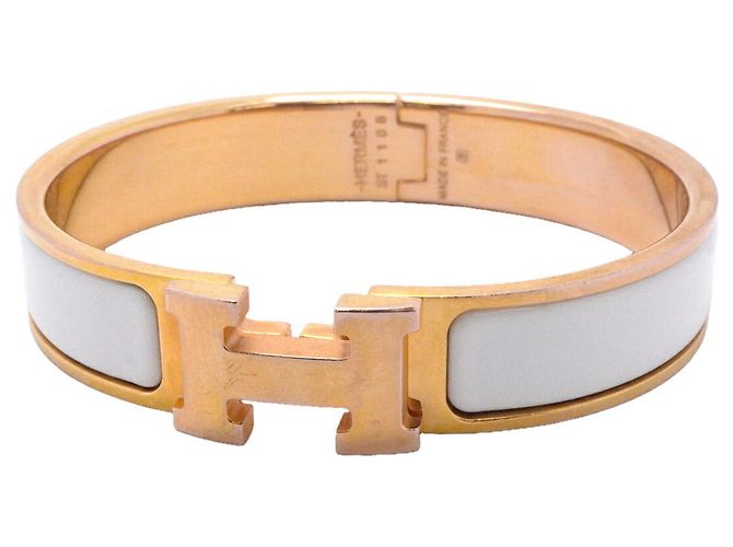 Brazalete Hermès Clic Clac PM Blanco Dorado
