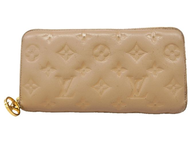 Cartera Louis Vuitton Monogram Coussin Zippy en Taupe Gris pardo