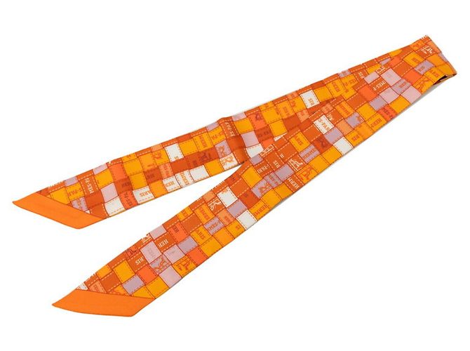 Hermès Pañuelo Hermes Twilly Bolduc en seda naranja