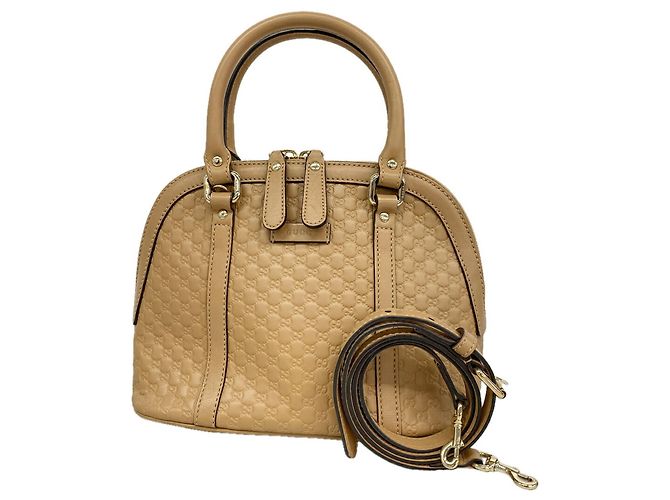 Bolsa de mão Gucci Microguccissima em couro bege