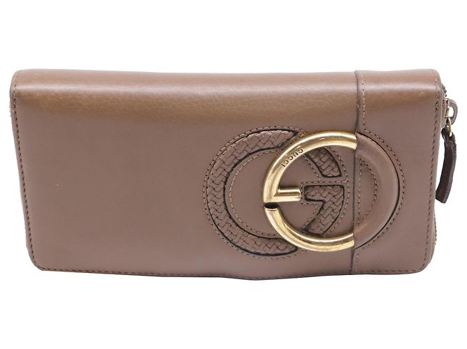 Portefeuille long zippé Gucci Interlocking G en cuir marron