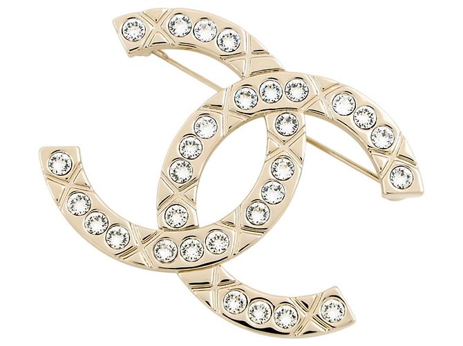 Broche Chanel Coco Mark Dourado