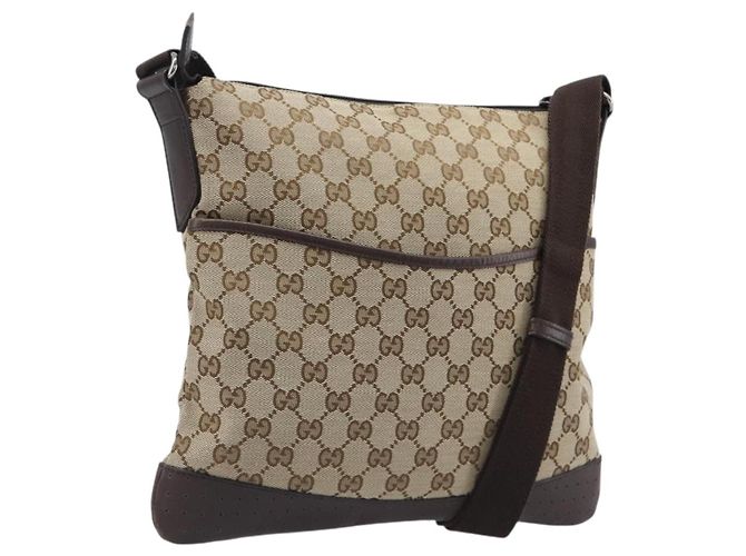 Sac Messenger Gucci avec fermeture éclair en toile GG et cuir perforé Medium Beige