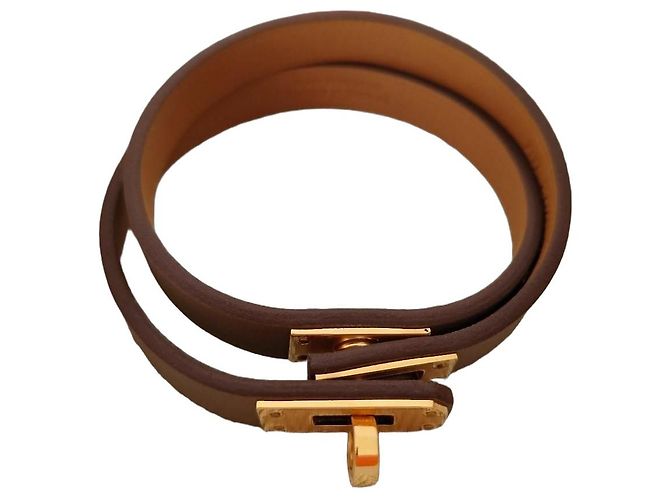 Bracelete Hermès em couro e metal dourado