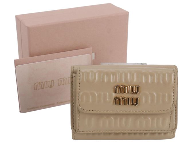 Portafoglio tri-fold in pelle Miu Miu