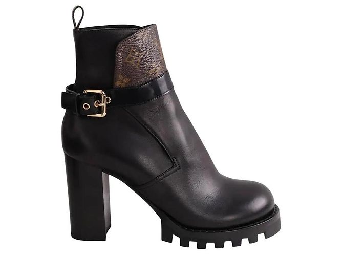 Botas Louis Vuitton de couro preto com fivelas