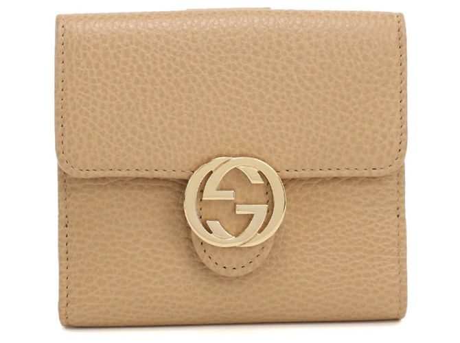 Cartera bi-fold Gucci en Beige