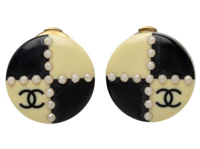 Brincos de clip Chanel Coco Mark