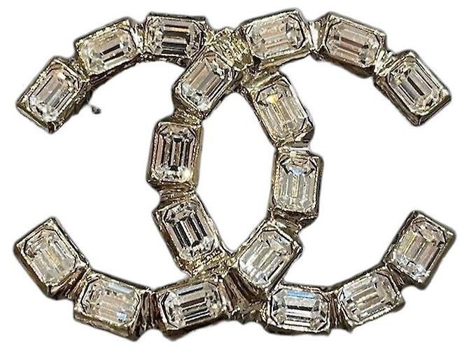 Broche Chanel CC em metal dourado com cristais