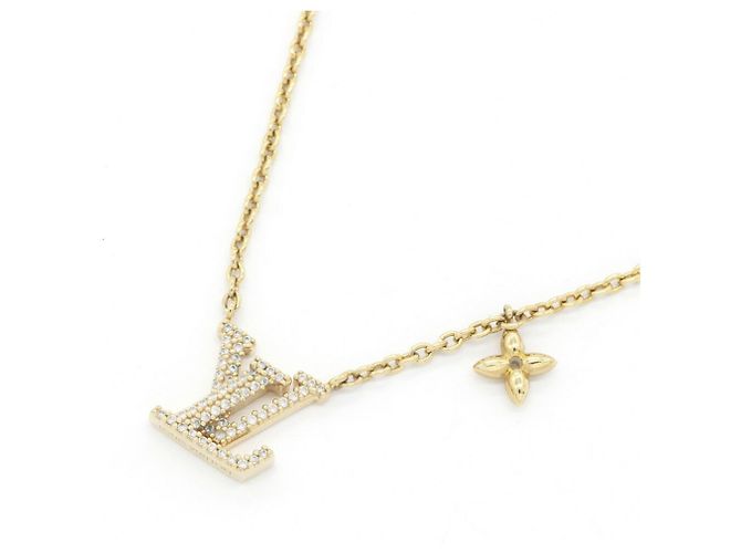 Colar com pendente Louis Vuitton em metal dourado e strass