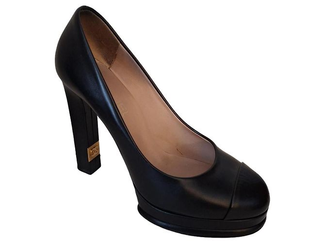 Chanel black leather pumps