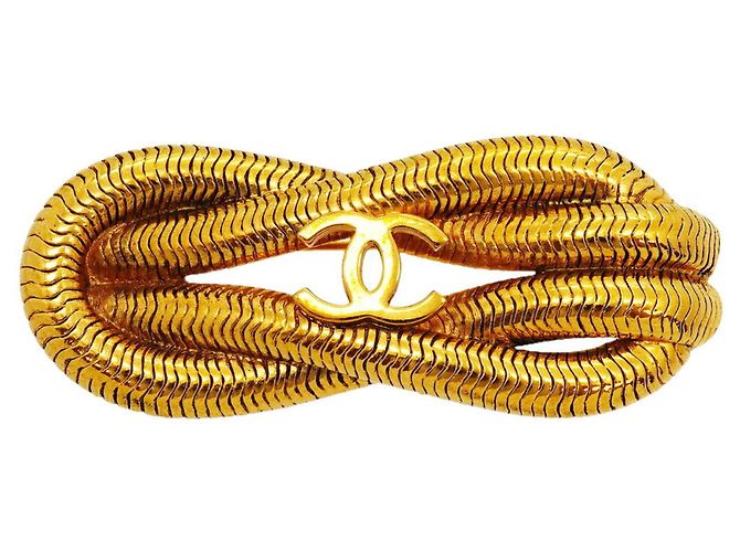 Broche Chanel banhada a ouro