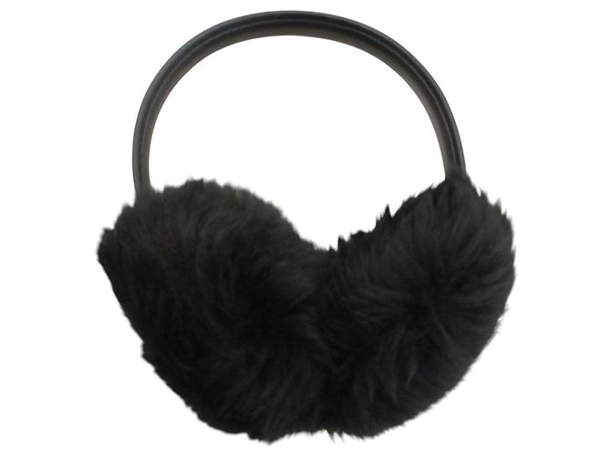 Paraorecchie Coach in pelle di pecora shearling