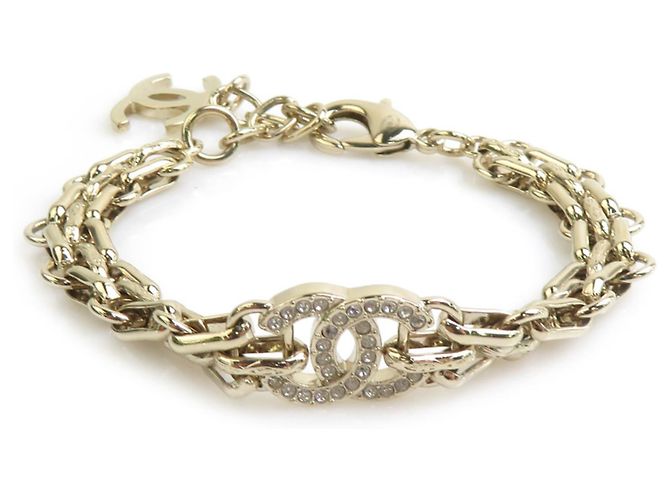 Pulsera de dijes de metal dorado Chanel