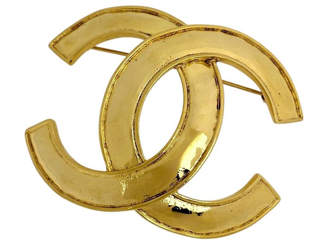 Spilla Chanel placcata in oro con logo Coco