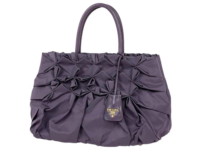 Bolsa de mão Prada roxa de nylon e couro