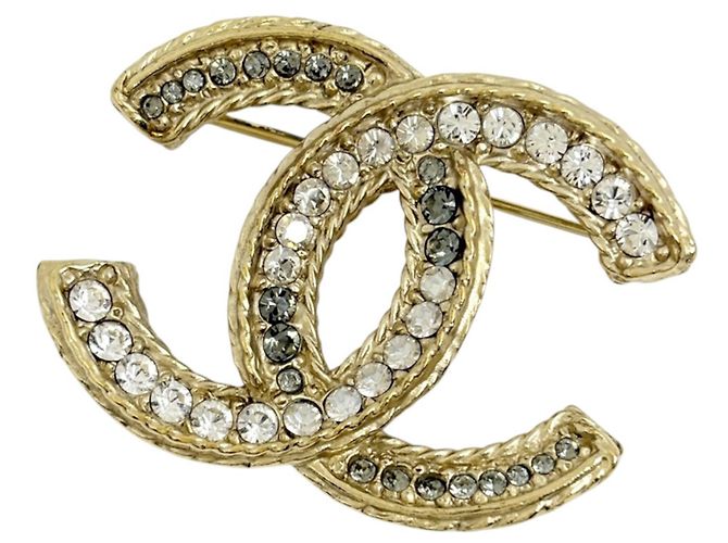 Spilla Chanel placcata oro con strass
