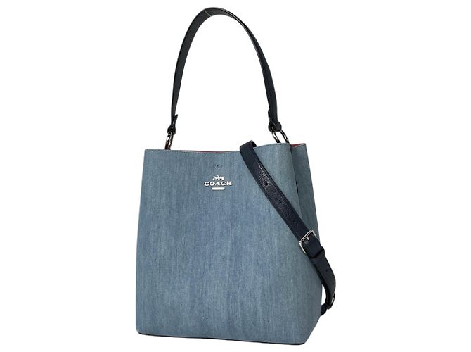 Bolsa Coach em denim azul claro