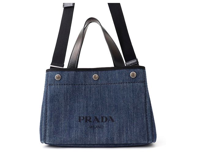 Bolsa de mão Prada em denim e couro preto azul