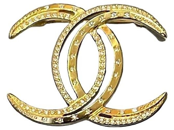 Broche Chanel Lua dourada