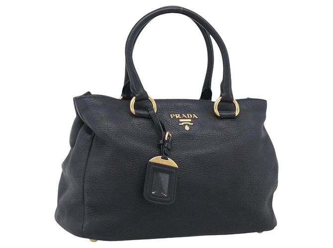 PRADA Sac à main en cuir noir ton or