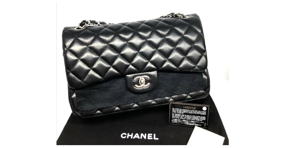 Timeless Chanel Black lambskin Jumbo classic flap bag Leather ref.172123