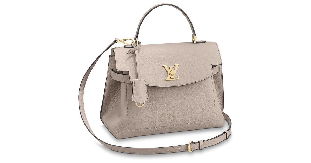 Louis Vuitton LV lockme clutch new Beige Leather ref.239325 - Joli