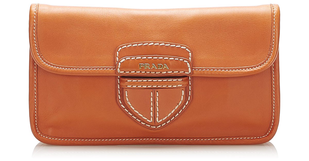 Leather clutch bag Prada Orange in Leather - 13380828