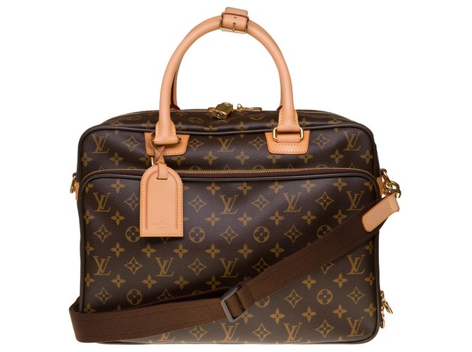 Louis Vuitton Alize travel bag in monogram canvas and natural leather