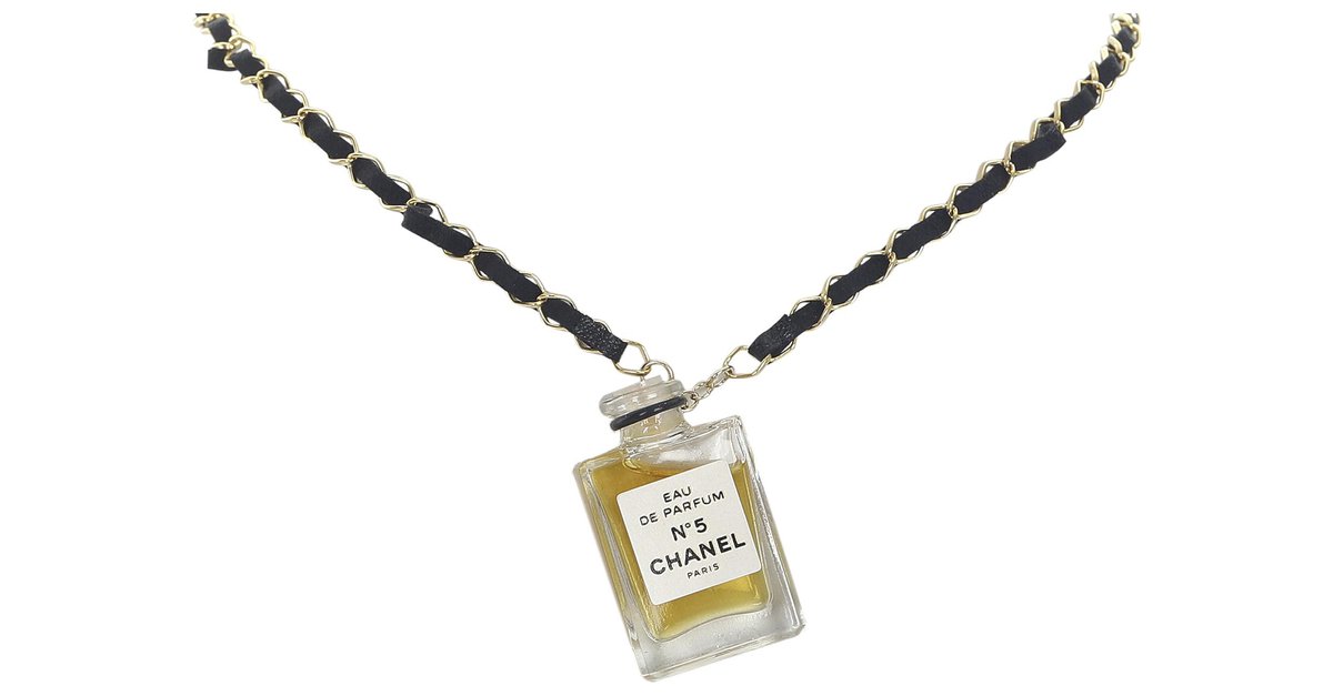Chanel Gold Chanel No.5 Perfume Bottle Necklace Black Golden Metal  ref.306304 - Joli Closet